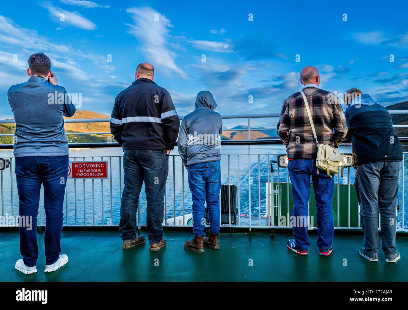 People watching as the car ferry leaves Ullapool in the Scottish