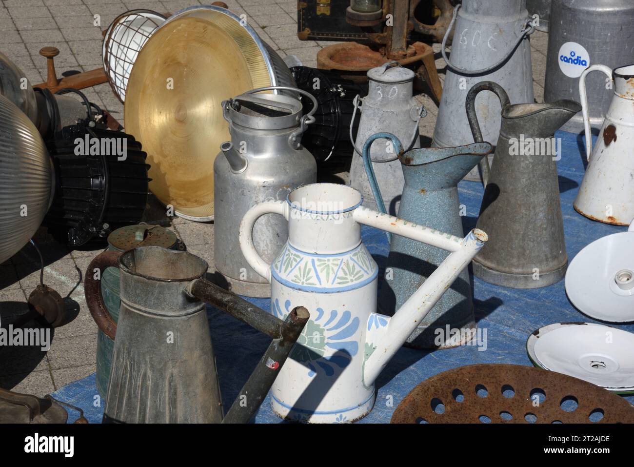 Vintage, Collectable or Collectible Watering Cans and Milk Churns on Market Stall, Antiquities Market or Brocante Provence France Stock Photo