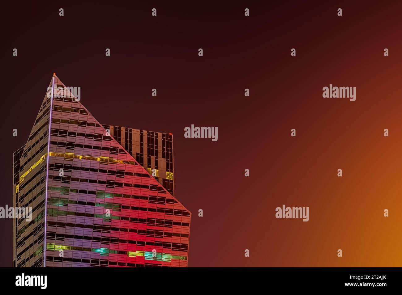 A vibrant city skyline at night, illuminated by a vast array of ...