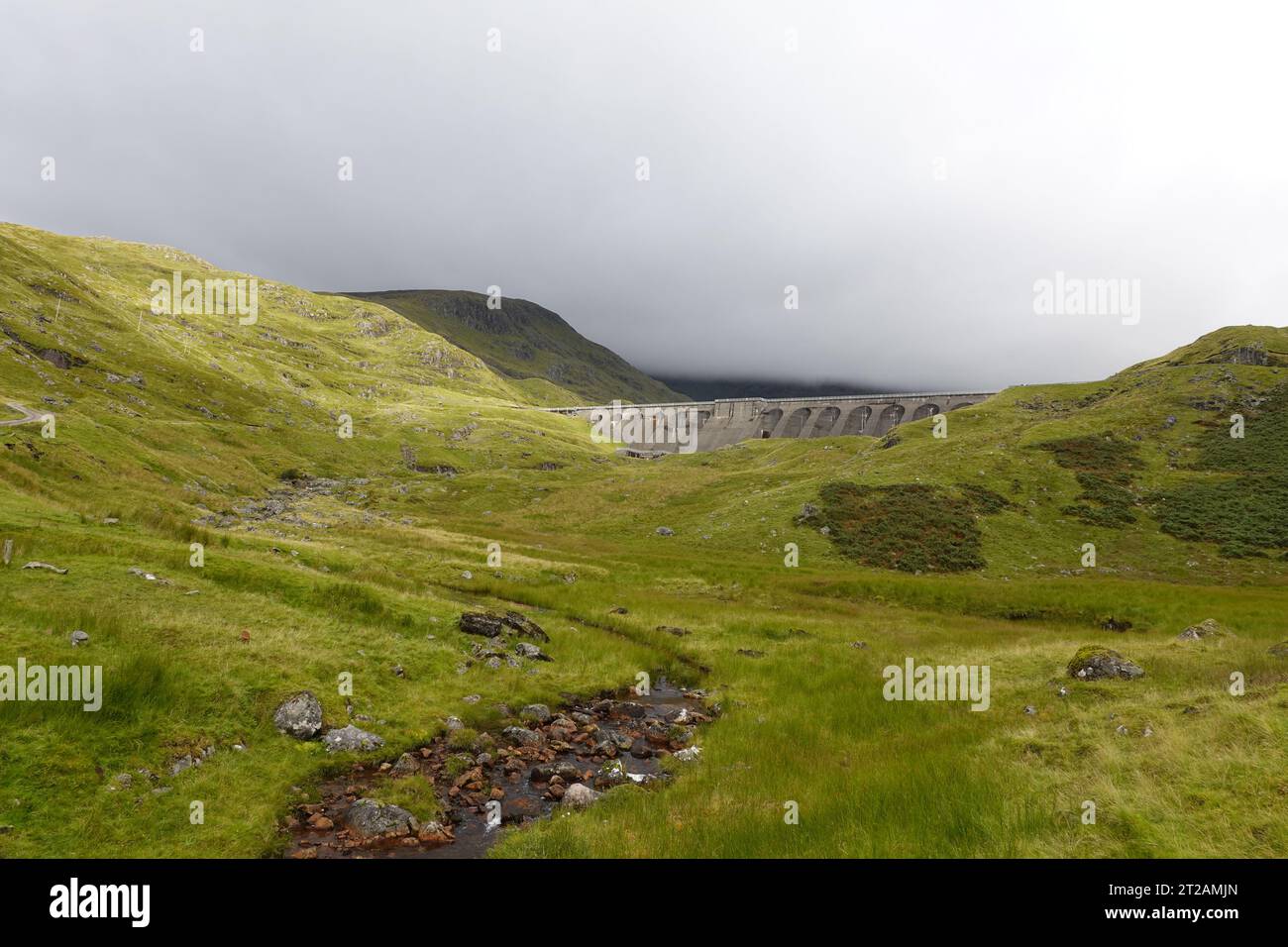 Cruachan Dam at Cruachan reservoir below Munro mountain Ben Cruachan, Scottish Highlands, Scotland Stock Photo