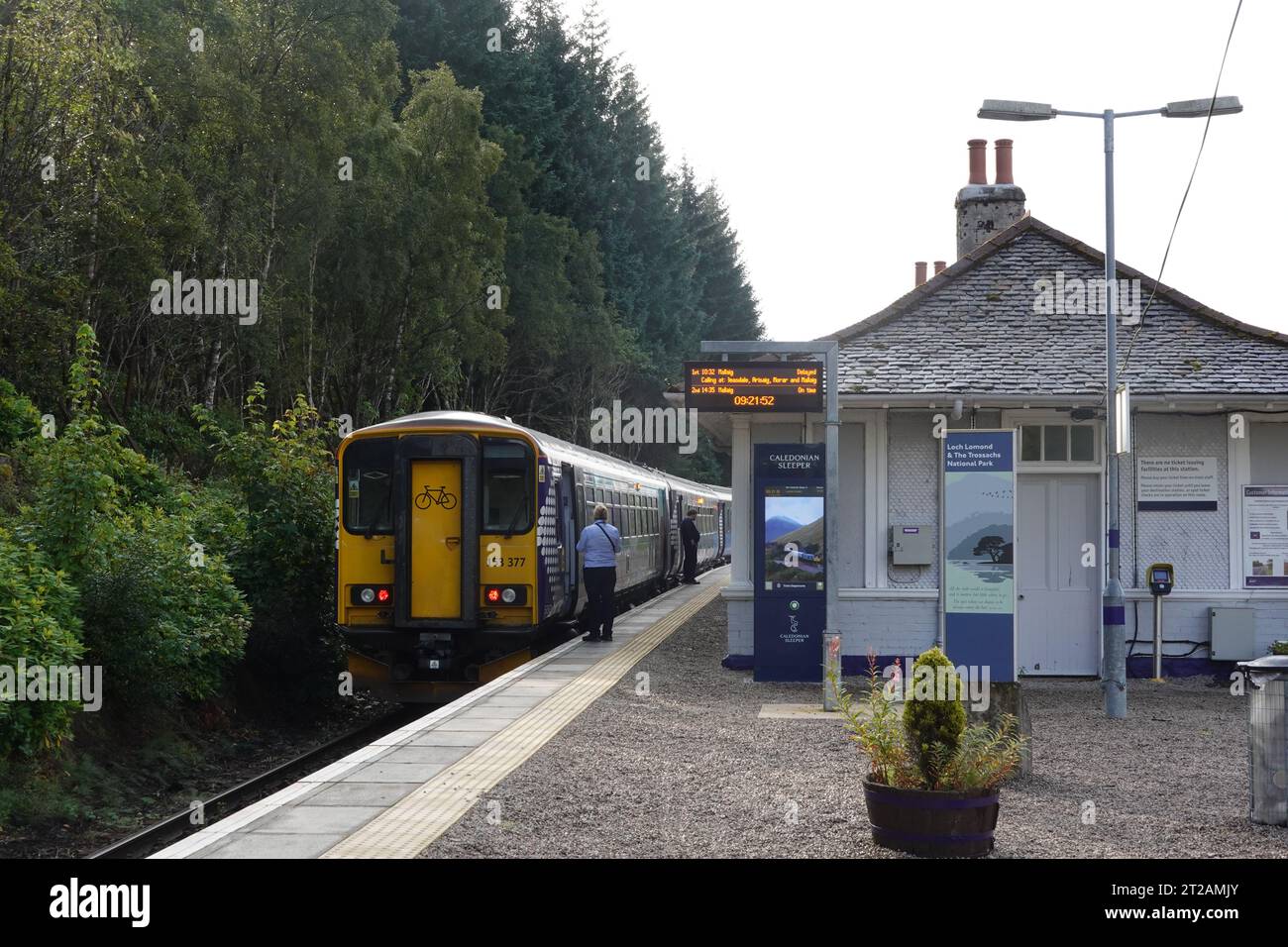 Train at Bridge of Orchy railway station heading to Glasgow. West Highland Line, Scotland, United Kingdom Stock Photo