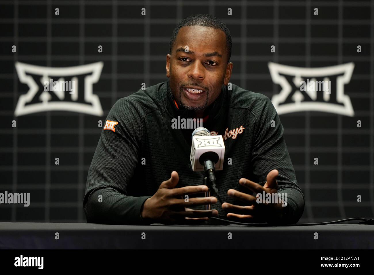 Oklahoma State coach Mike Boynton addresses the media during the NCAA