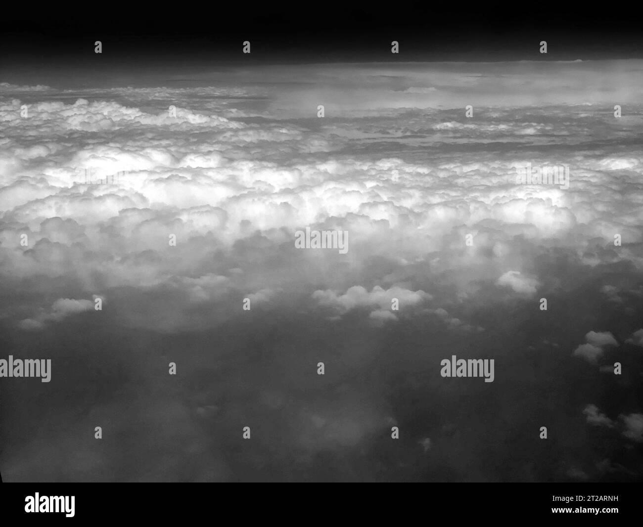 Clouds as they are seen from airplane, sky with clouds background, amazing flight over fluffy clouds Stock Photo