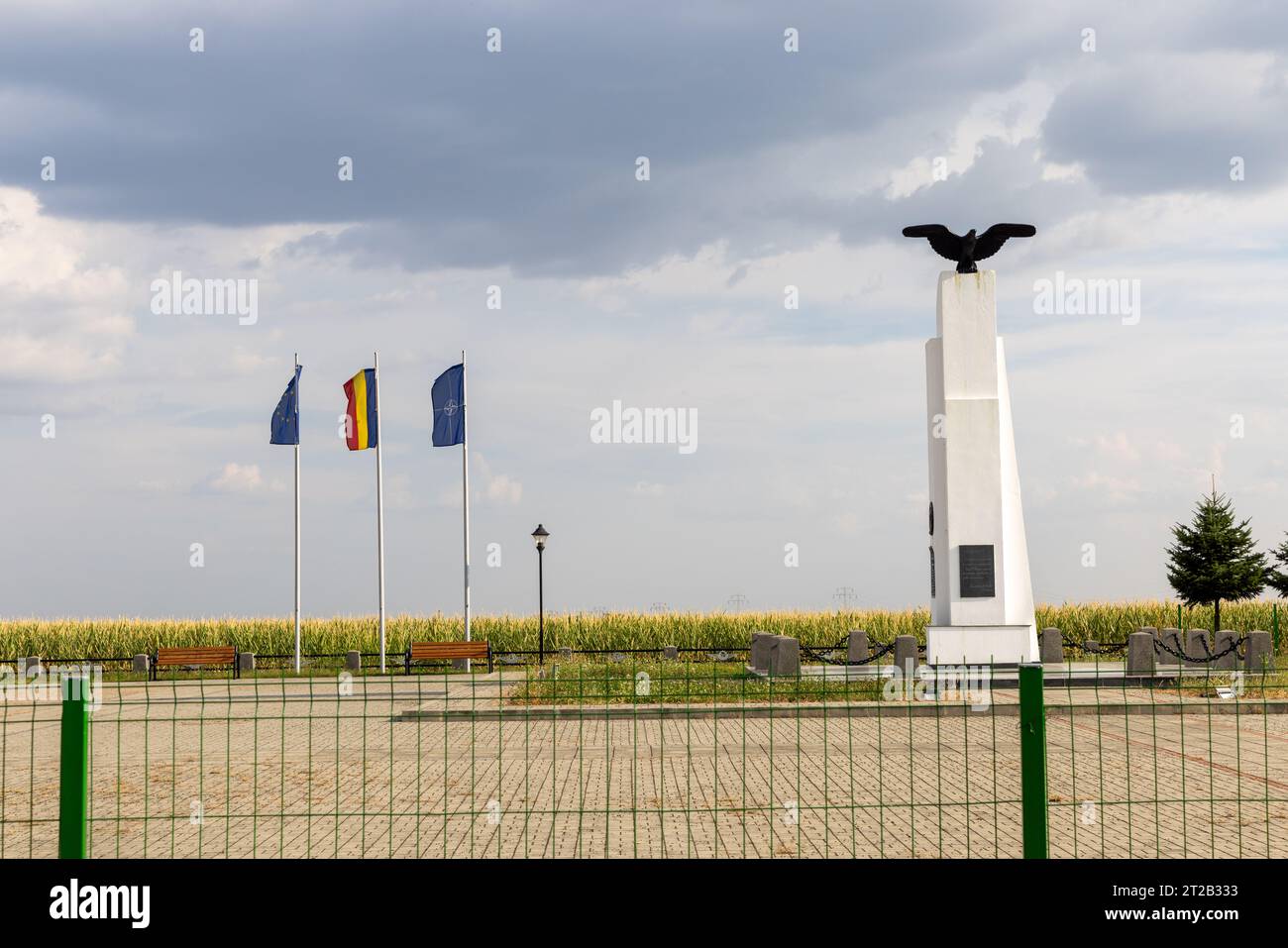 Memorial monument of Aurel Vlaicu (Monumentul lui Aurel Vlaicu de la Bănești ) with bronze eagle and flags of Romania, Nato and European Union Stock Photo