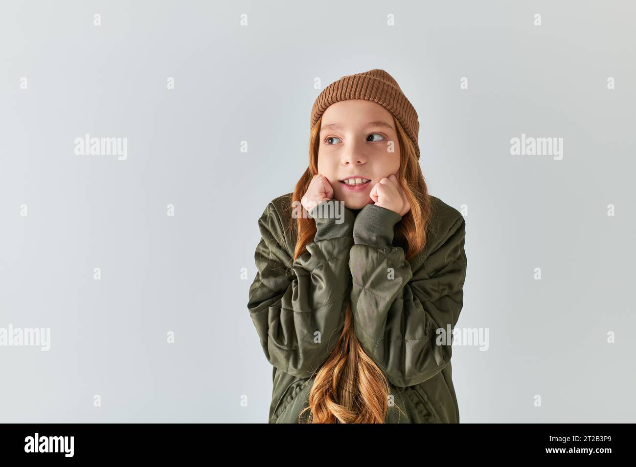 preteen-girl-in-stylish-winter-outfit-with-knitted-hat-feeling-cold