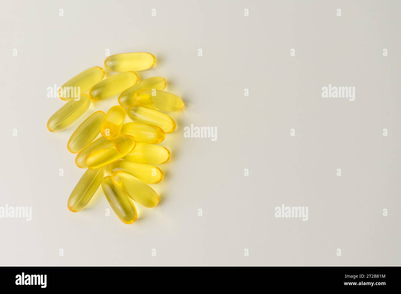 Omega3rich wild salmon and fish oil capsules presented on a soft off