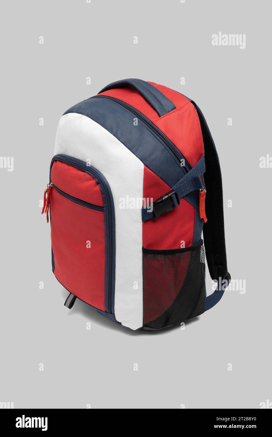 close up trendy fashionable school backpack red and white color isolated on white background with clipping path. side view shoulder strap bag. Stock Photo