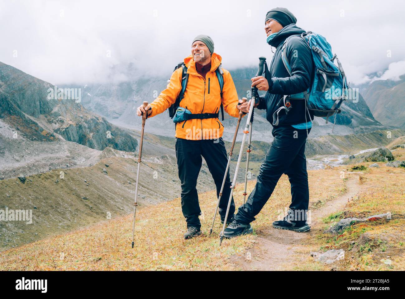 Men with trekking poles hi-res stock photography and images - Alamy