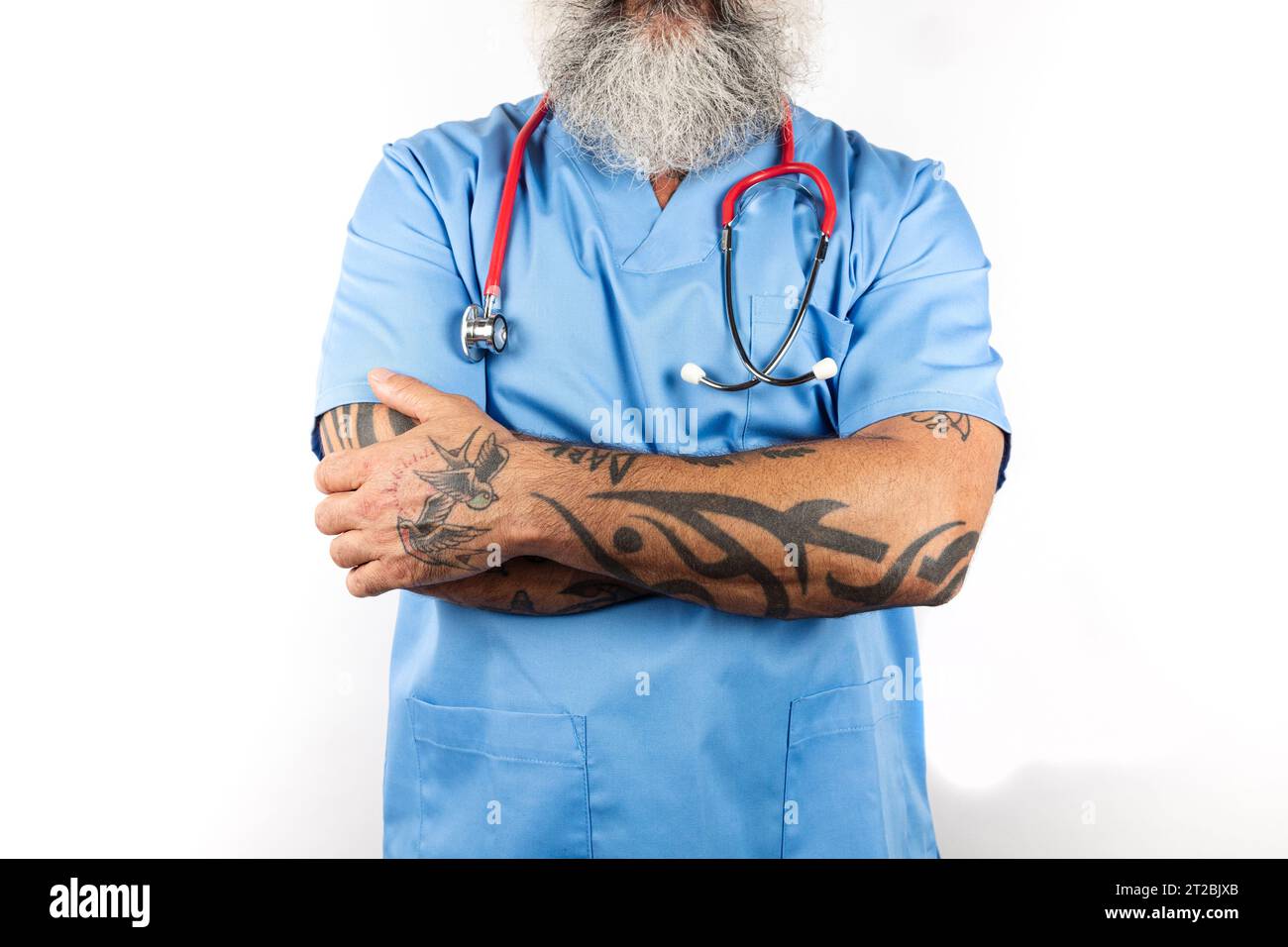 Portrait of a modern male nurse with arms crossed on a white background Stock Photo
