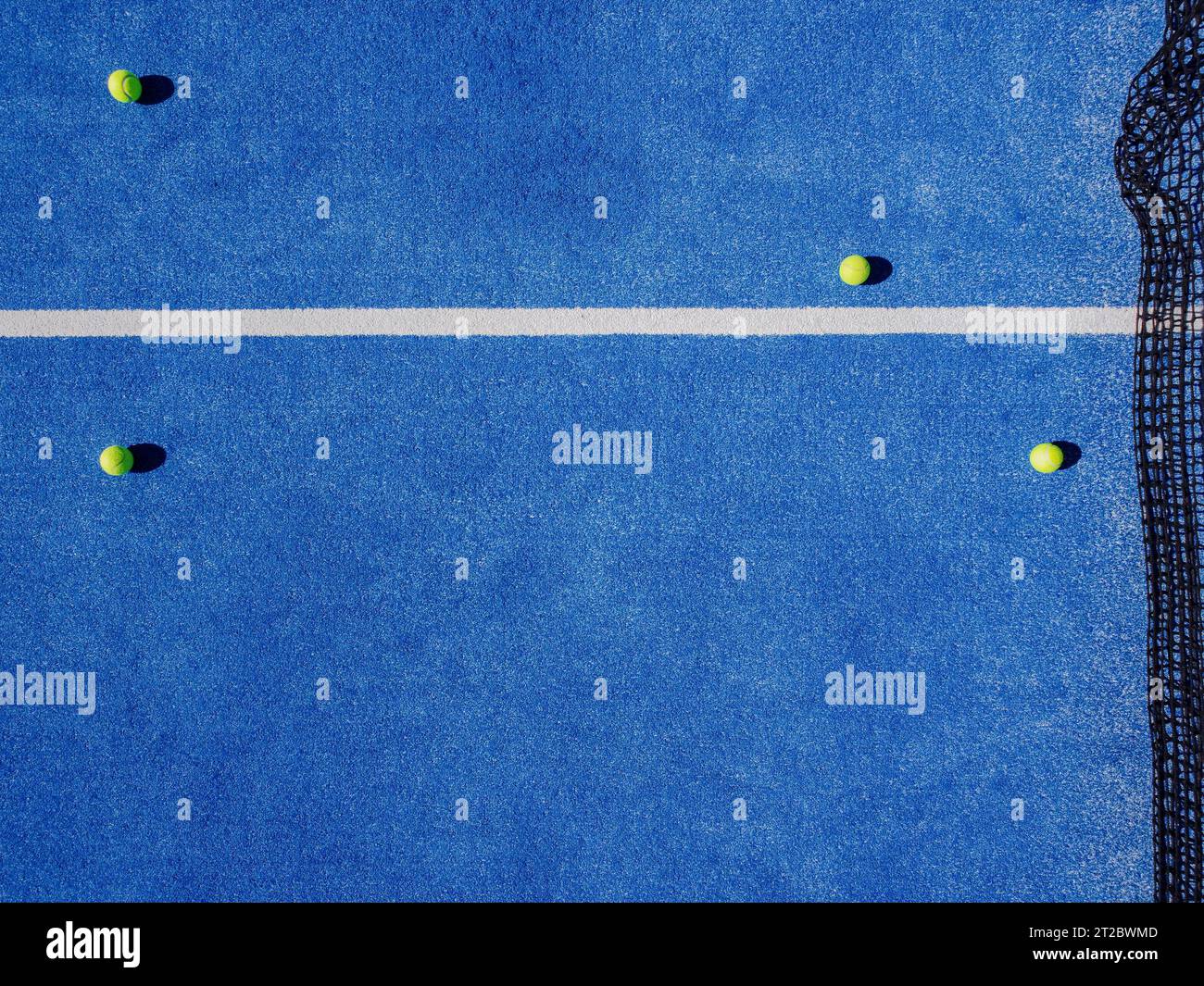 Overhead aerial view of four balls on a paddle tennis court Stock Photo