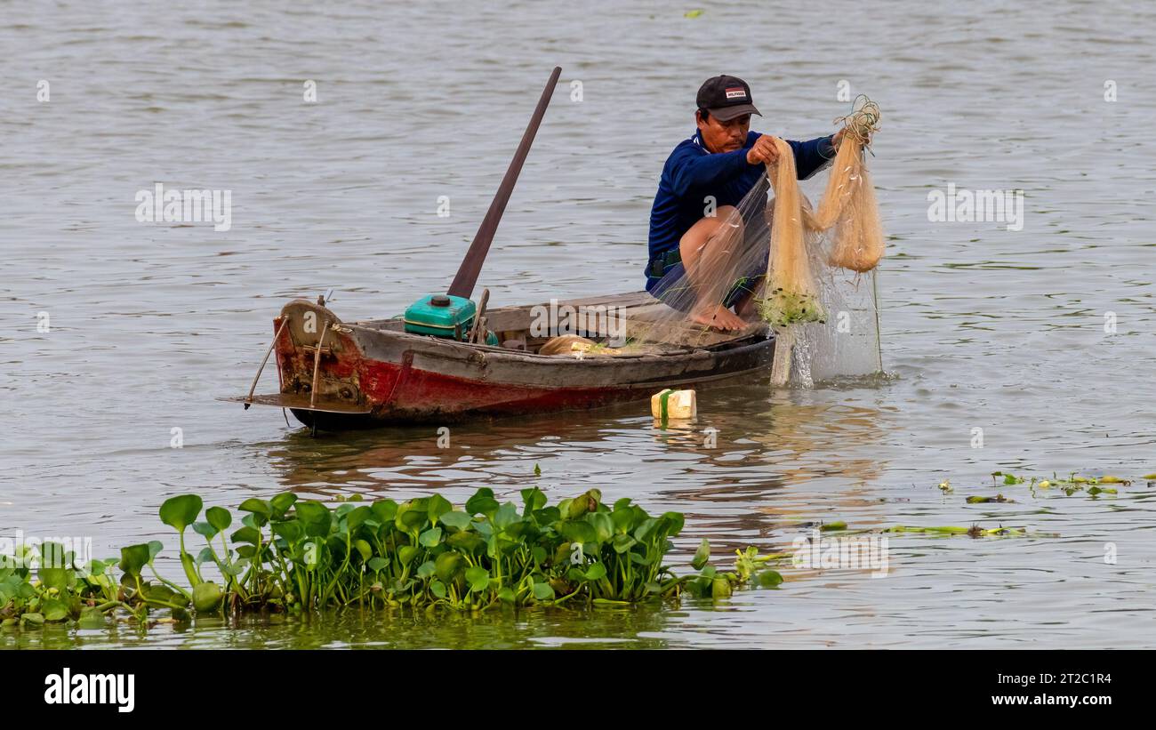 Fishing Boat on River at Chau Doc, Vietnam Stock Photo