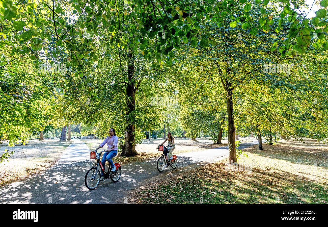 People Cycling in Hyde Park London UK Stock Photo
