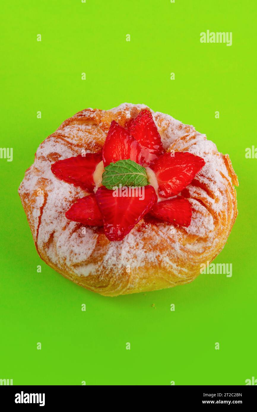 Fresh fruits Danish isolated on solid light green background Stock Photo