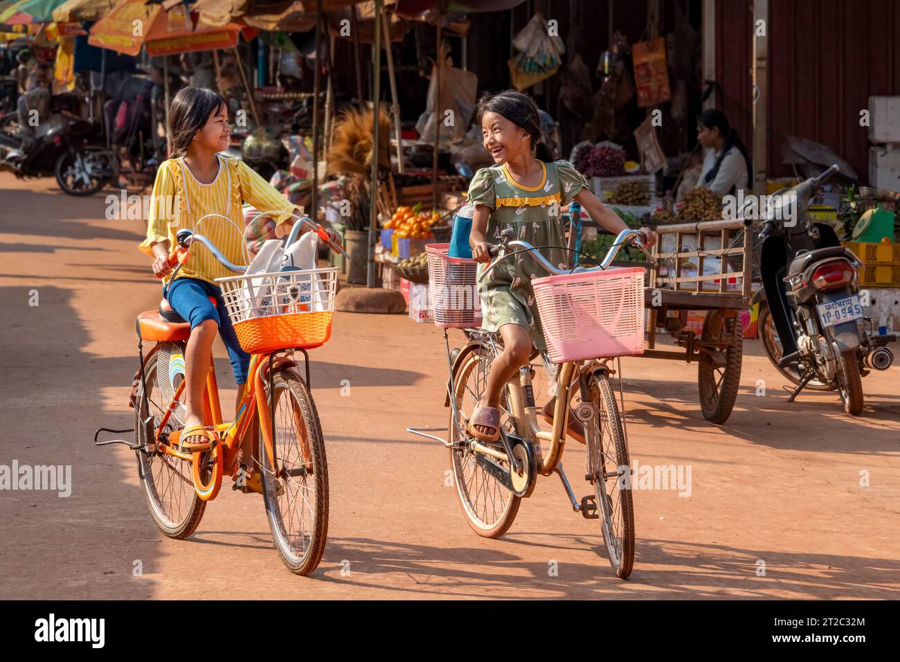 Best Freind Cycling Though Local Market at Siem Reap, Cambodia Stock Photo
