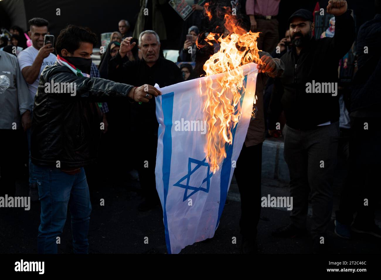 Tehran, Tehran, Iran. 18th Oct, 2023. Iranian protestors burn an ...