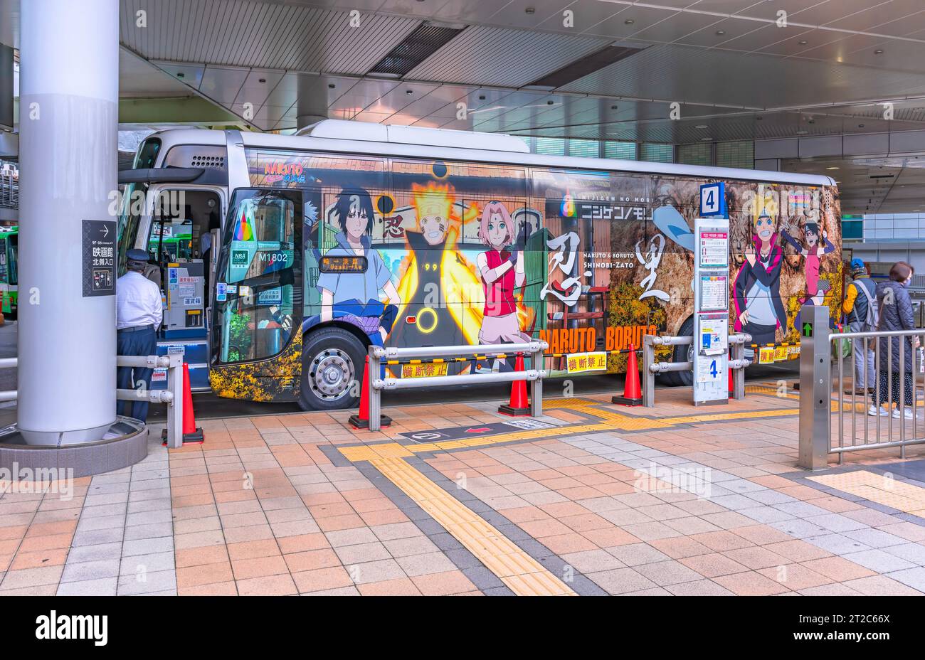 osaka, japan - dec 04 2022: Tourist bus leaving for Awaji island wrapped in an advertising sticker of characters from Japanese manga and anime Naruto Stock Photo