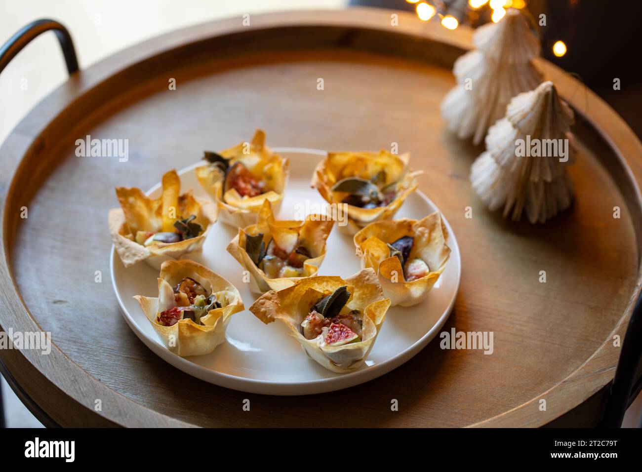 Christmas canapes, filo pastry cups with figs and blue cheese Stock Photo