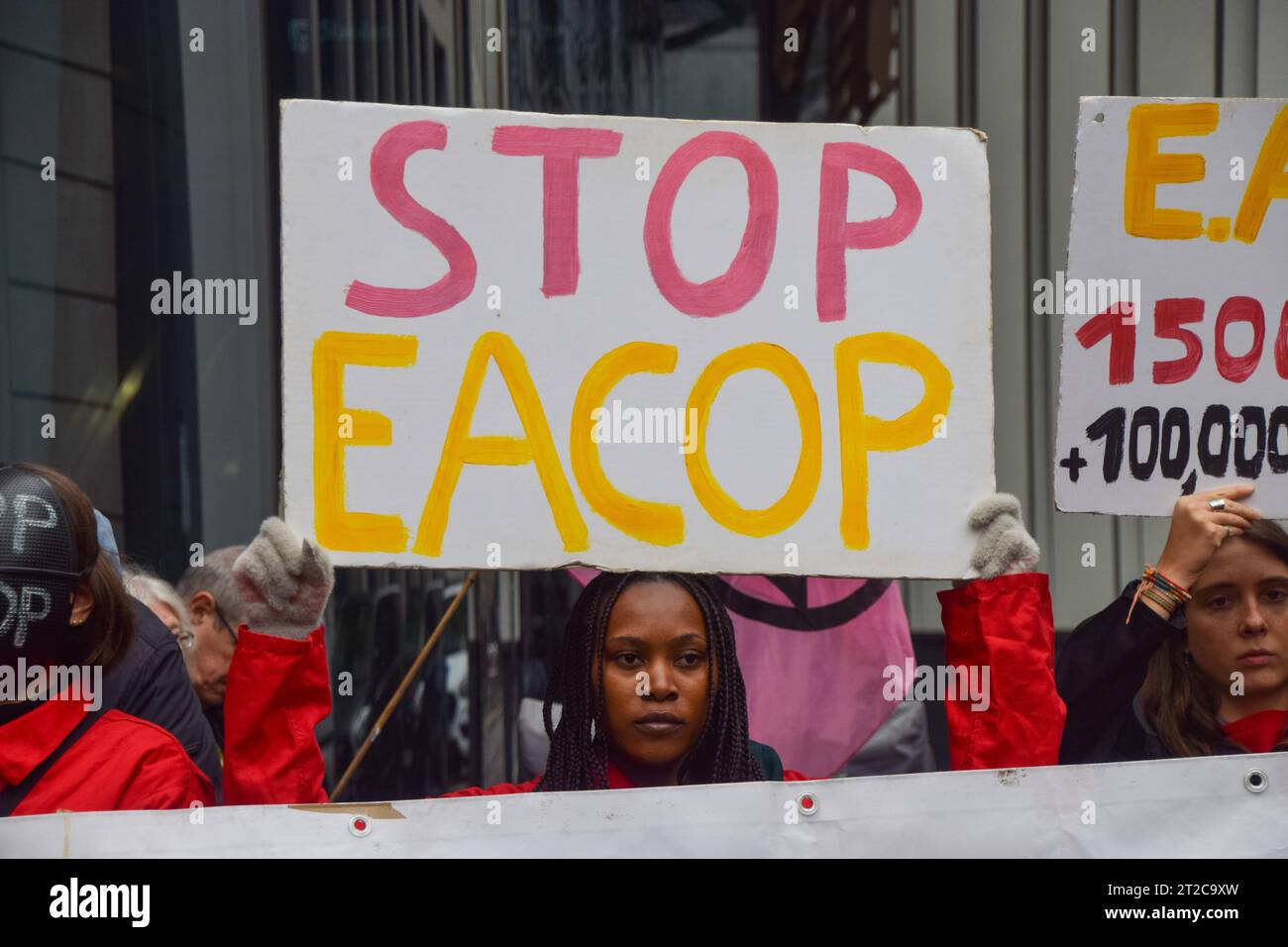 London, UK. 18th Oct, 2023. A protester holds an anti-EACOP placard during the demonstration. Climate activists gathered outside Standard Bank in the City of London in protest against the East African Crude Oil Pipeline (EACOP), calling on the bank to stop financing the project. (Photo by Vuk Valcic/SOPA Images/Sipa USA) Credit: Sipa USA/Alamy Live News Stock Photo