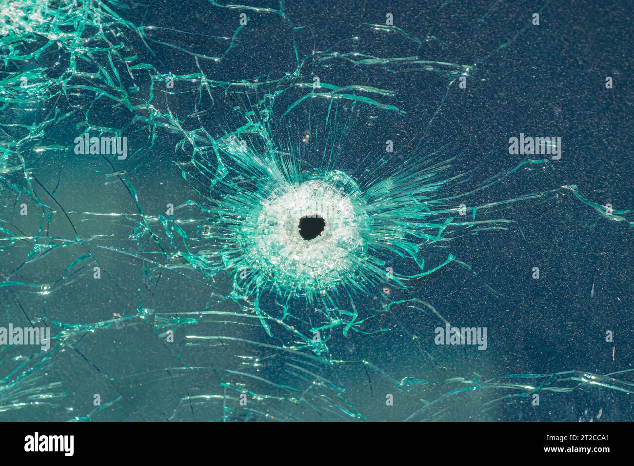 background bullet hole glass abstract crime gun shot. bullet wounds on