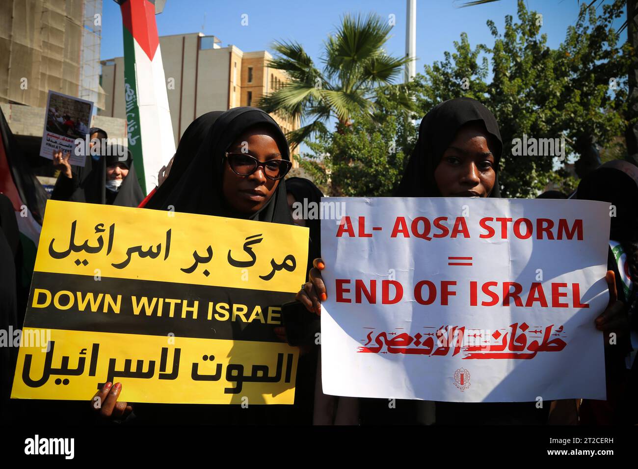 Tehran, Iran. 18th Oct, 2023. Veiled female protesters hold anti-Israel posters during an anti-Israel protest at Palestine Square in downtown Tehran. The protest erupted after Hamas-led authorities in Gaza said hundreds of people had been killed in an Israeli strike on a hospital in Gaza on 17 October. According to the Israel Defense Forces (IDF), the Islamic Jihad is responsible for the failed rocket launch that hit the hospital. Israel's arch-foe Iran, which backs both Hamas and Lebanon-based Hezbollah militants, has repeatedly warned against a Gaza invasion and raised on October 16 the sp Stock Photo