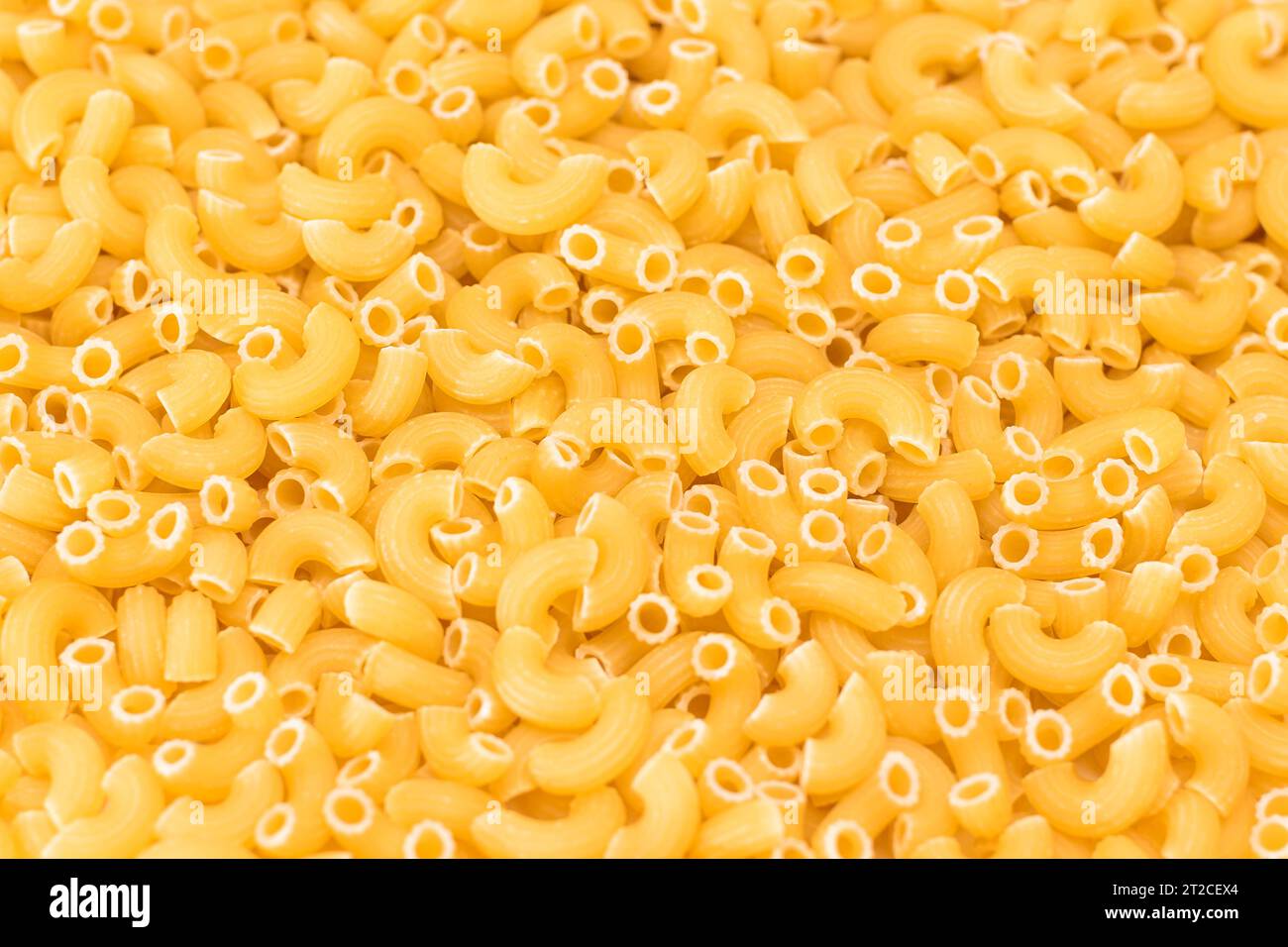 Uncooked Chifferi Rigati Pasta Background. Fat and Unhealthy Food ...