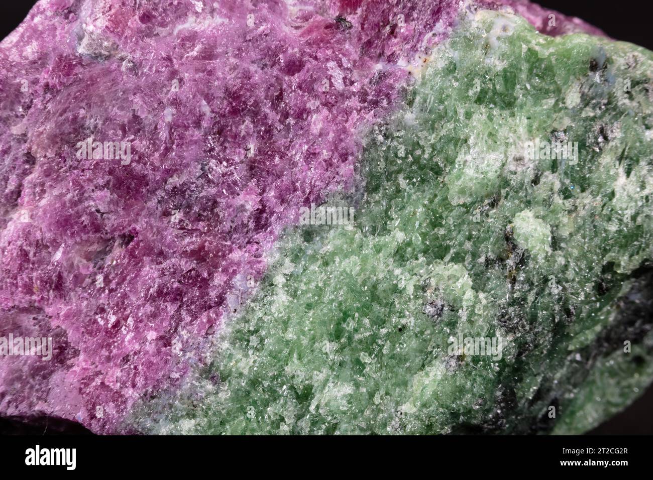 red crystal of natural origin. close up of crystals in ruby color on black  background Stock Photo