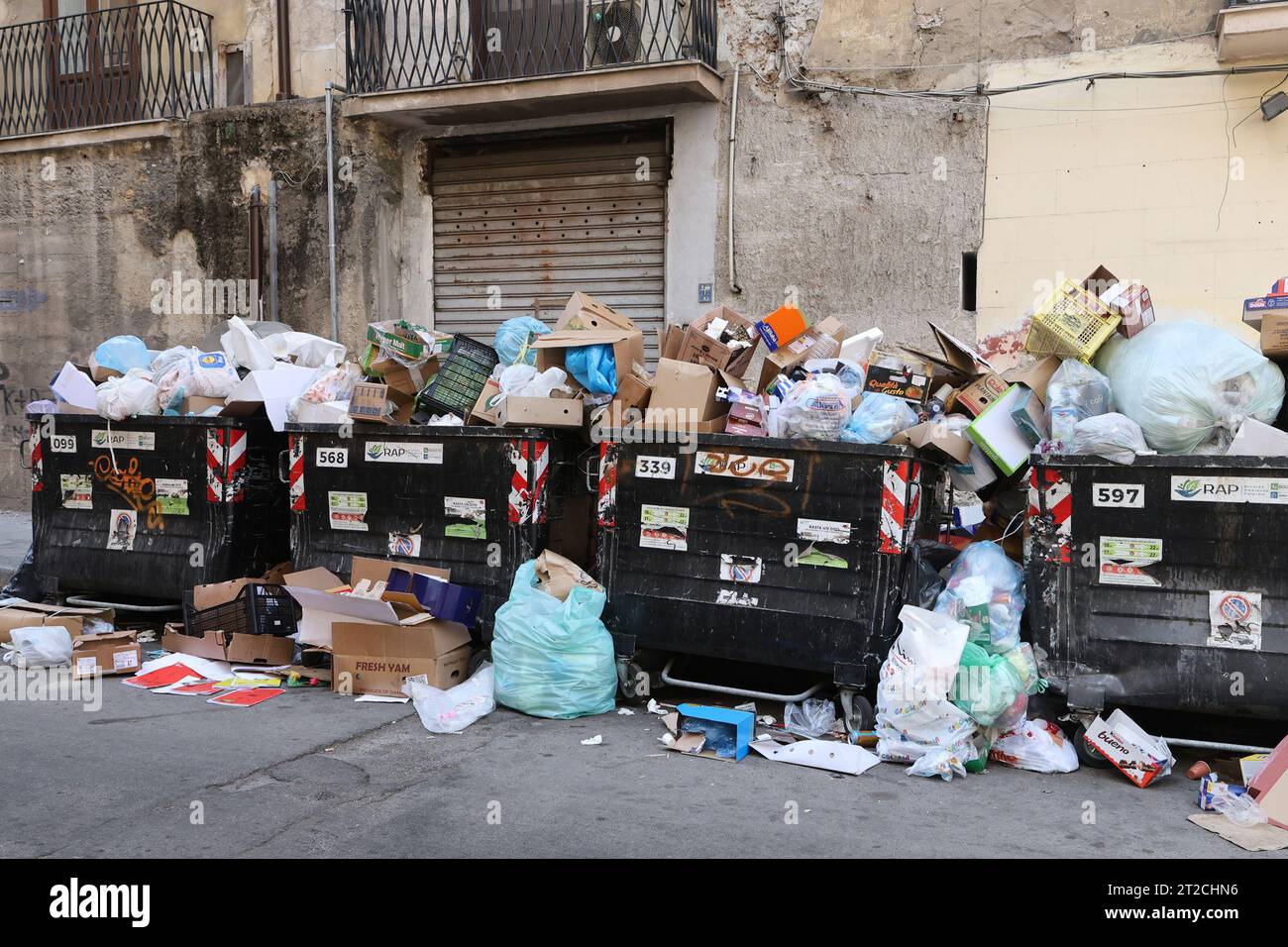 Overflowing rubbish bins in the Ballaro district of Palermo, Sicily, Italy Stock Photo