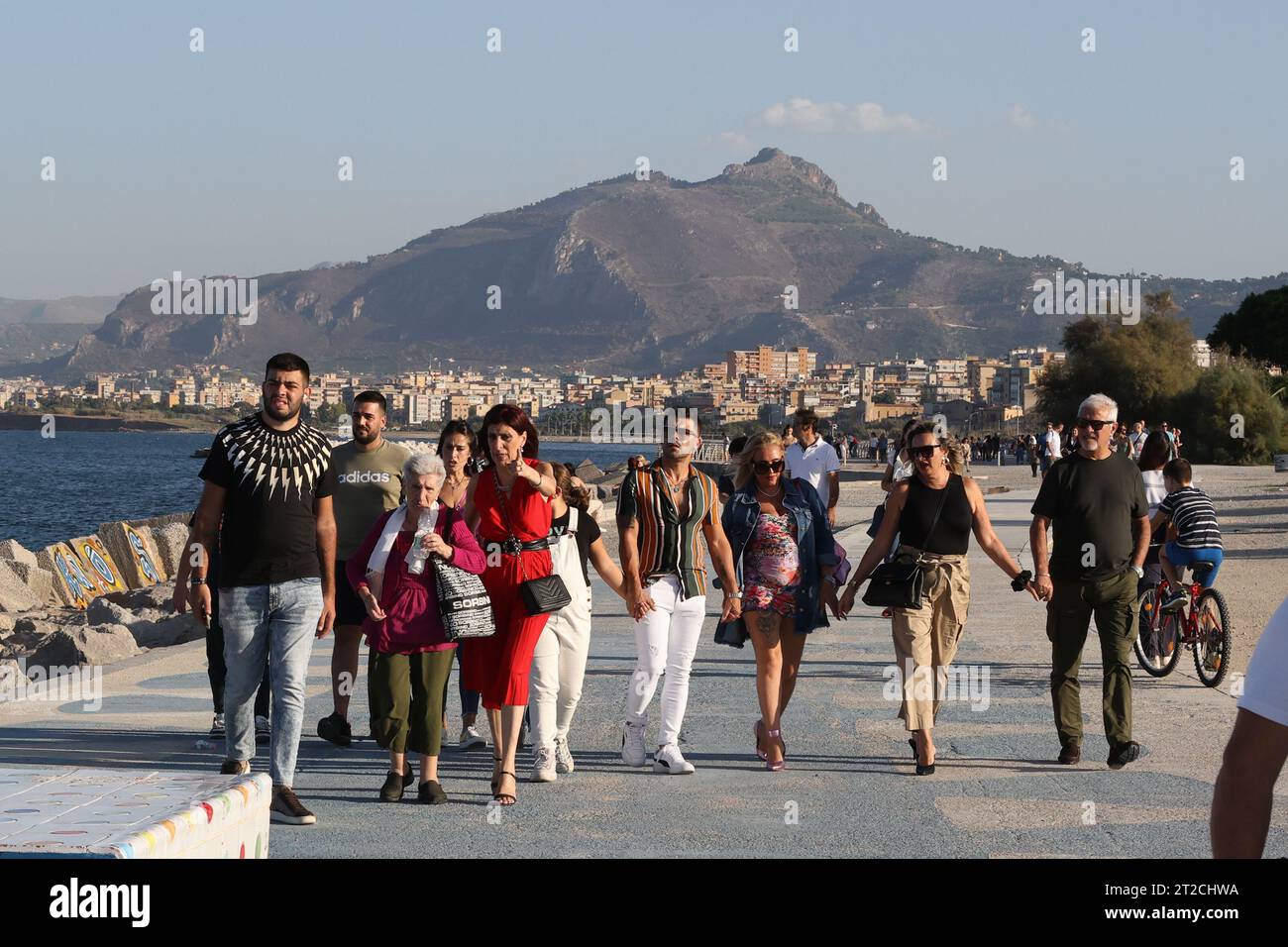Pedestrians stroll along the promenade on the seafront at Palermo, Sicily Stock Photo