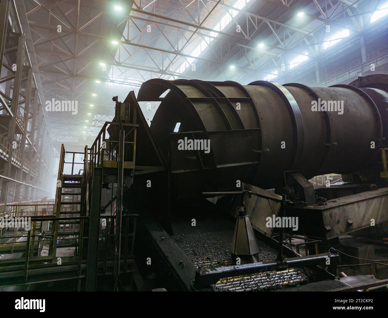 Production line of Iron ore pellets. Ore rumbling machines. Stock Photo