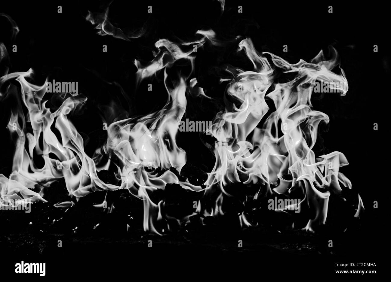 Blaze burning fire flame on art texture background Stock Photo - Alamy