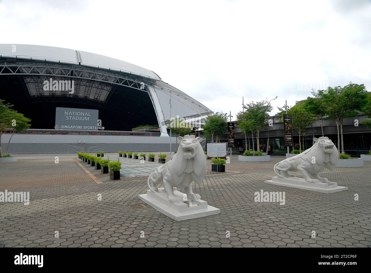 Stone lion statues standing guard in front of the steel dome of