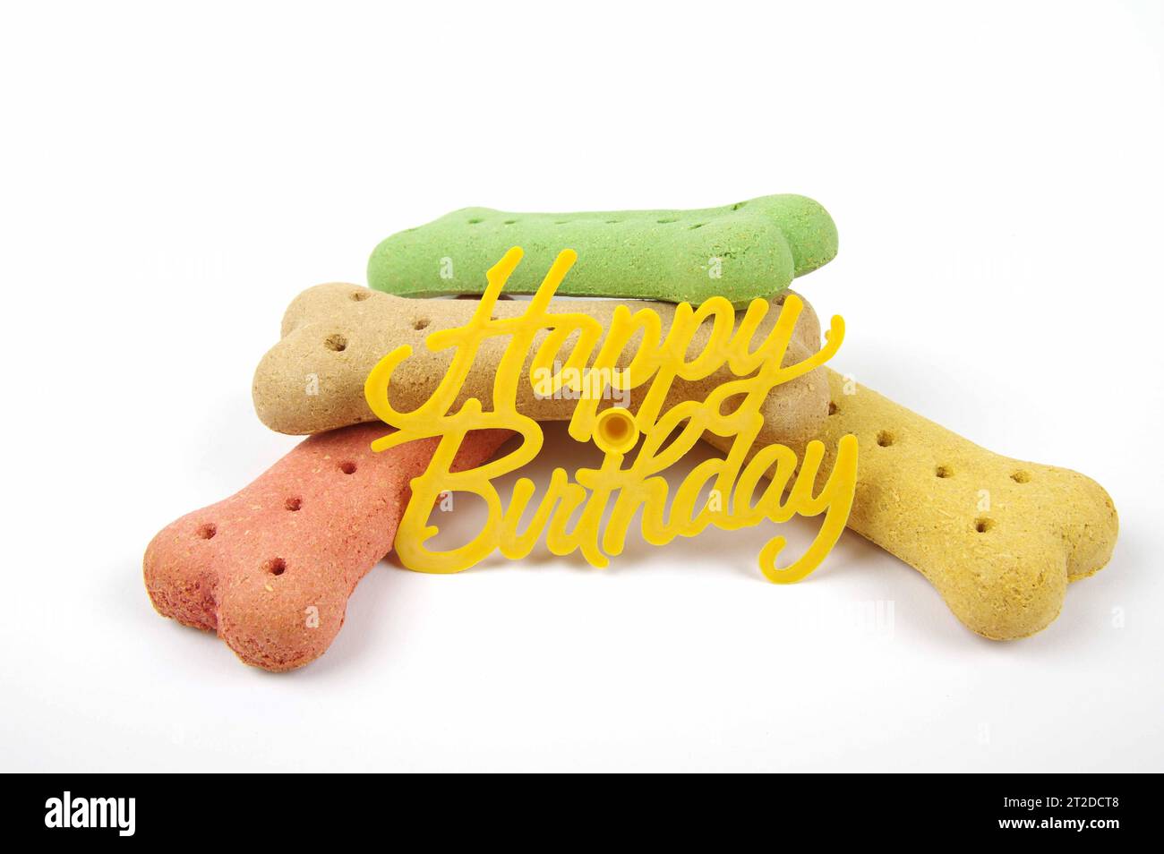happy birthday dog treats with a happy birthday sign on a white