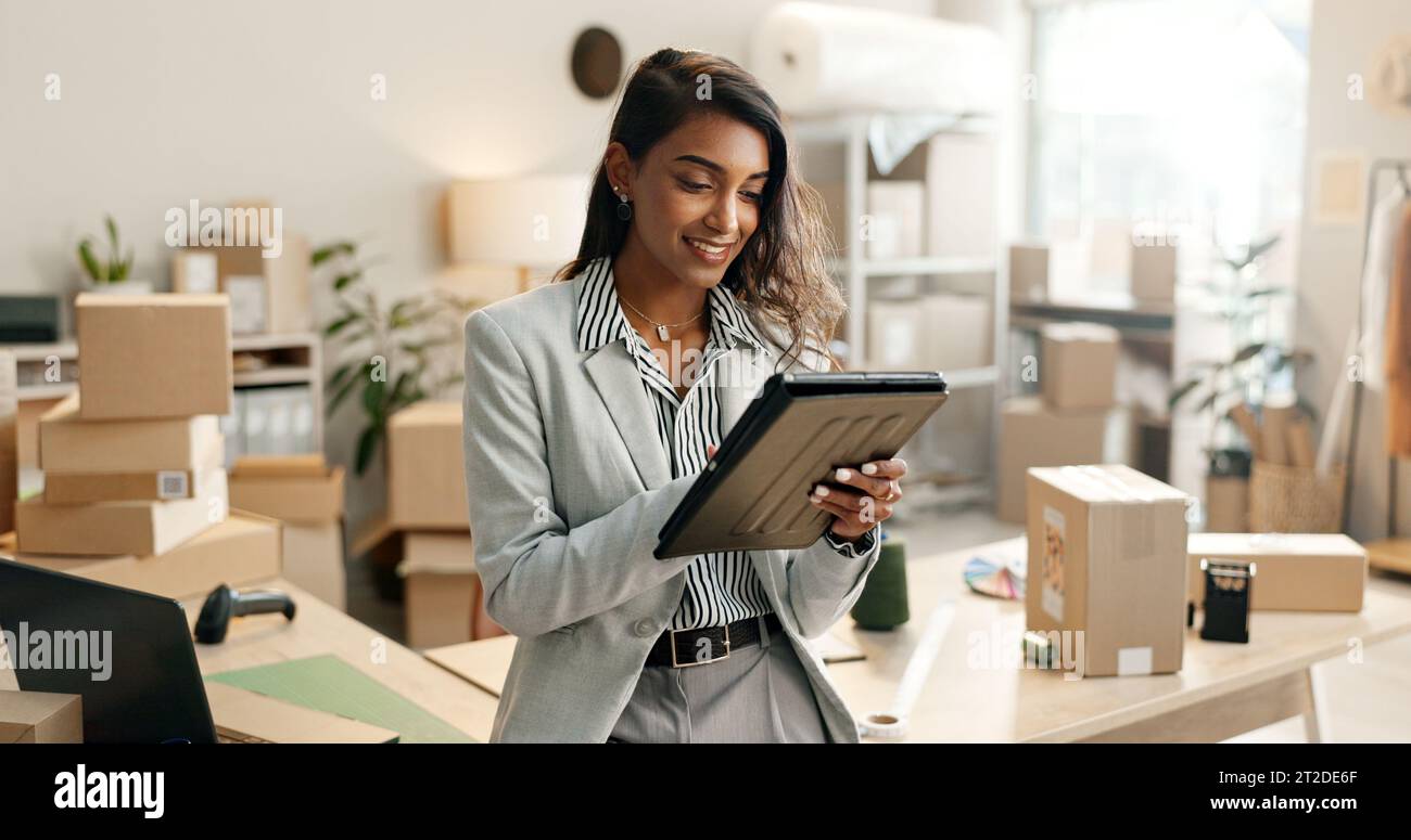 Small business, woman and tablet for e commerce, startup and inventory management of online shop, order or courier. Entrepreneur or Indian seller on Stock Photo