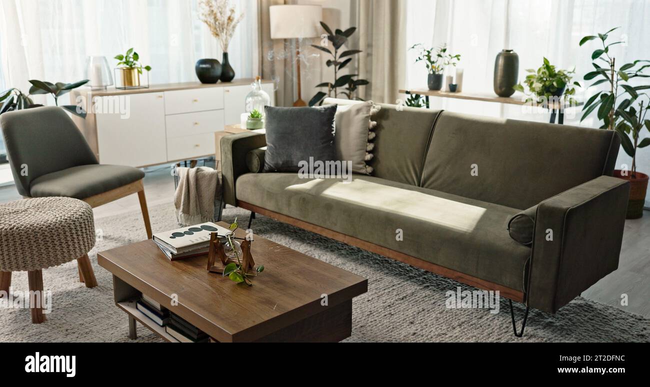 Home, interior and background of living room with sofa, couch and table ...