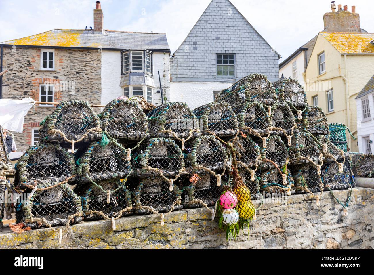 Port Isaac Cornwall, lobster and crab pots stacked on the harbour wall