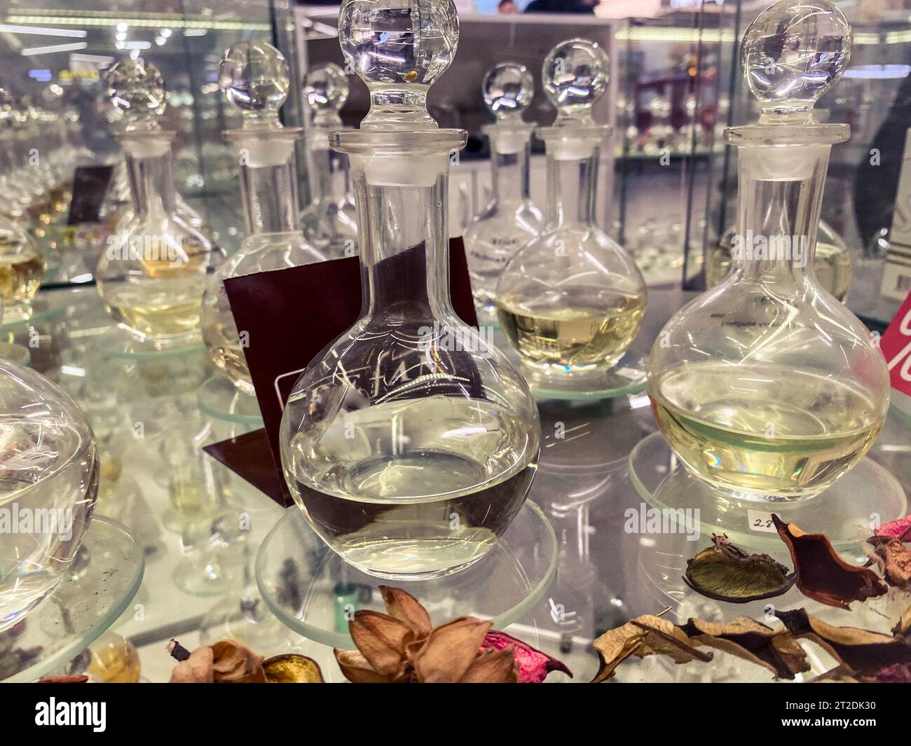 decorated transparent glass display case with perfume. perfumes in