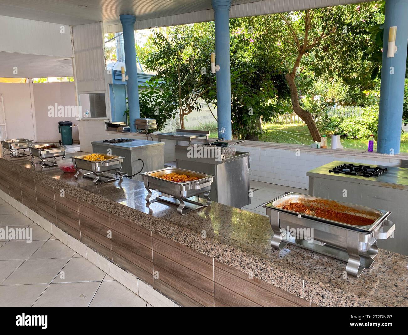 Allinclusive buffet food in heating trays in hotel restaurant with