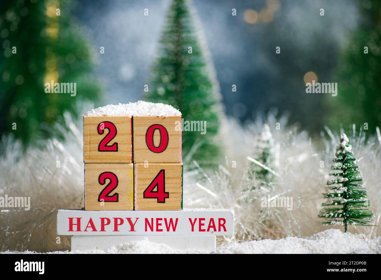 Happy New Year 2024 with Christmas tree winter holiday festive background and ornaments Stock Photo