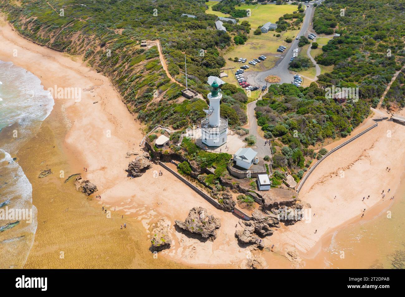 Aerial view of a tall white lighthouse on a cliff top surrounded by sandy beaches at Point Lonsdale on the Bellarine Peninsula in Victoria, Australia Stock Photo