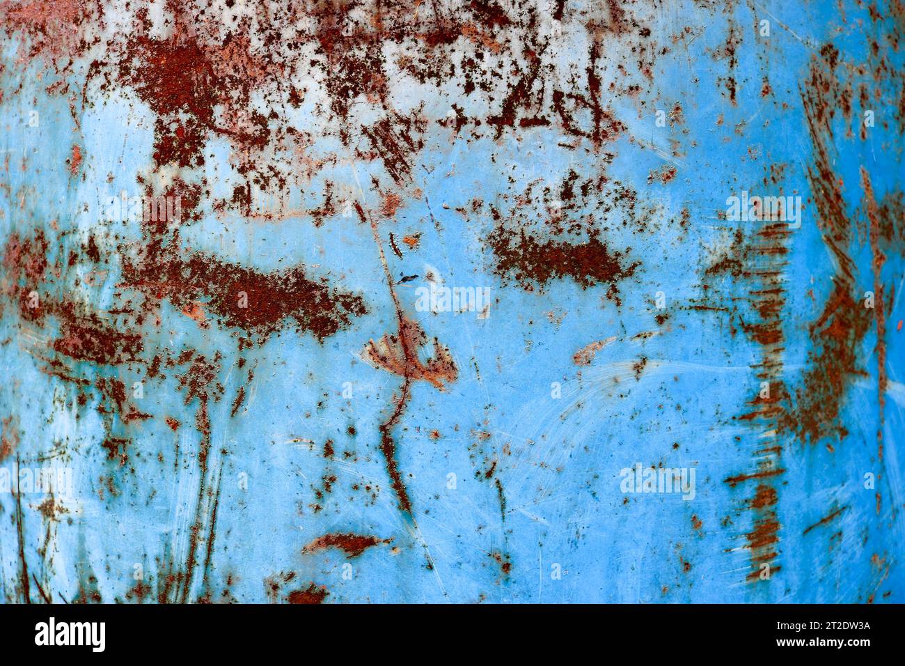 Texture of yellow rusty old shabby coarse rusty unique rust, oxidized metal, iron on blue peeling paint, background Stock Photo