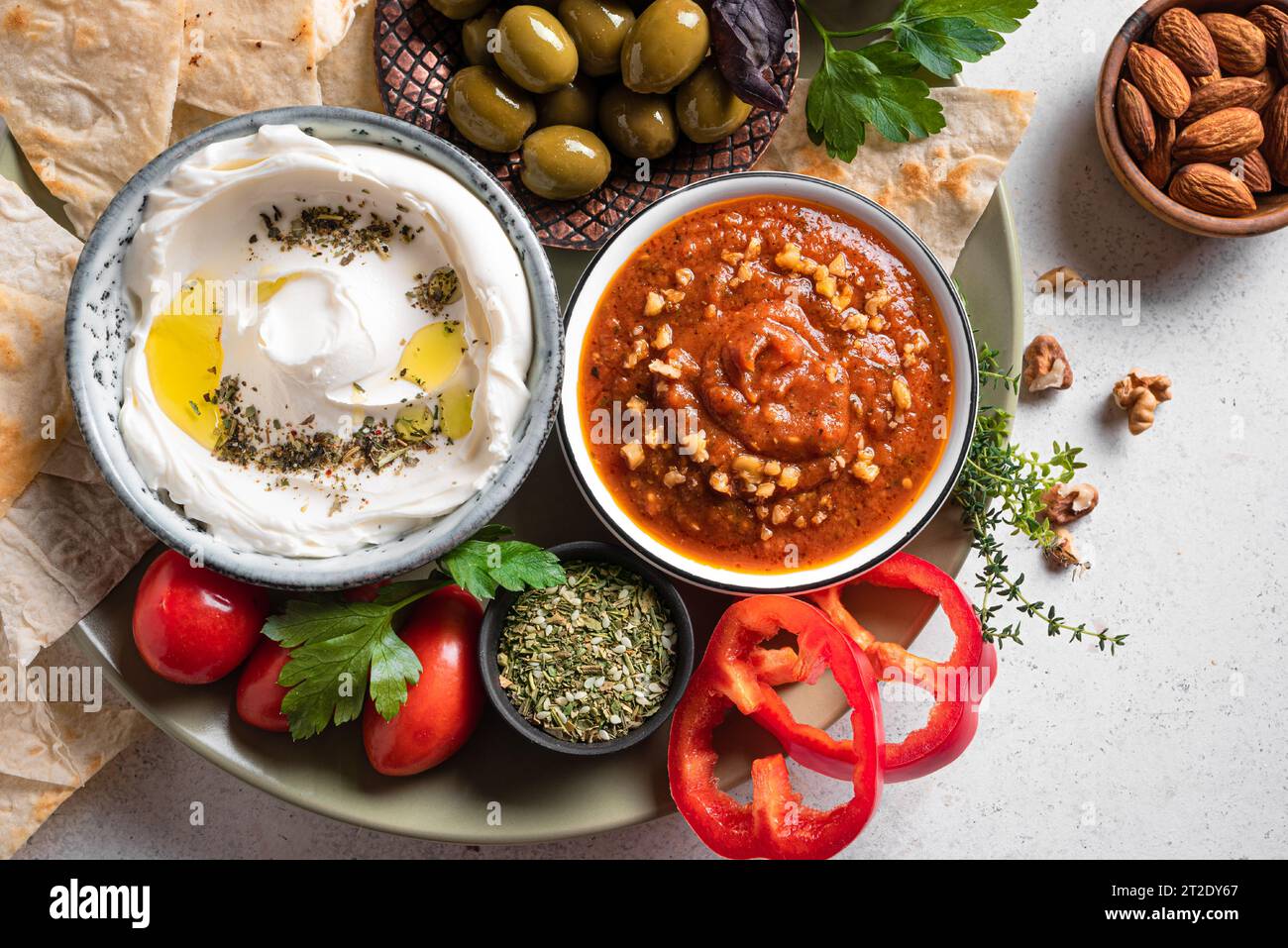Selection of arabic mezze plate labneh yogurt, muhammara dip with