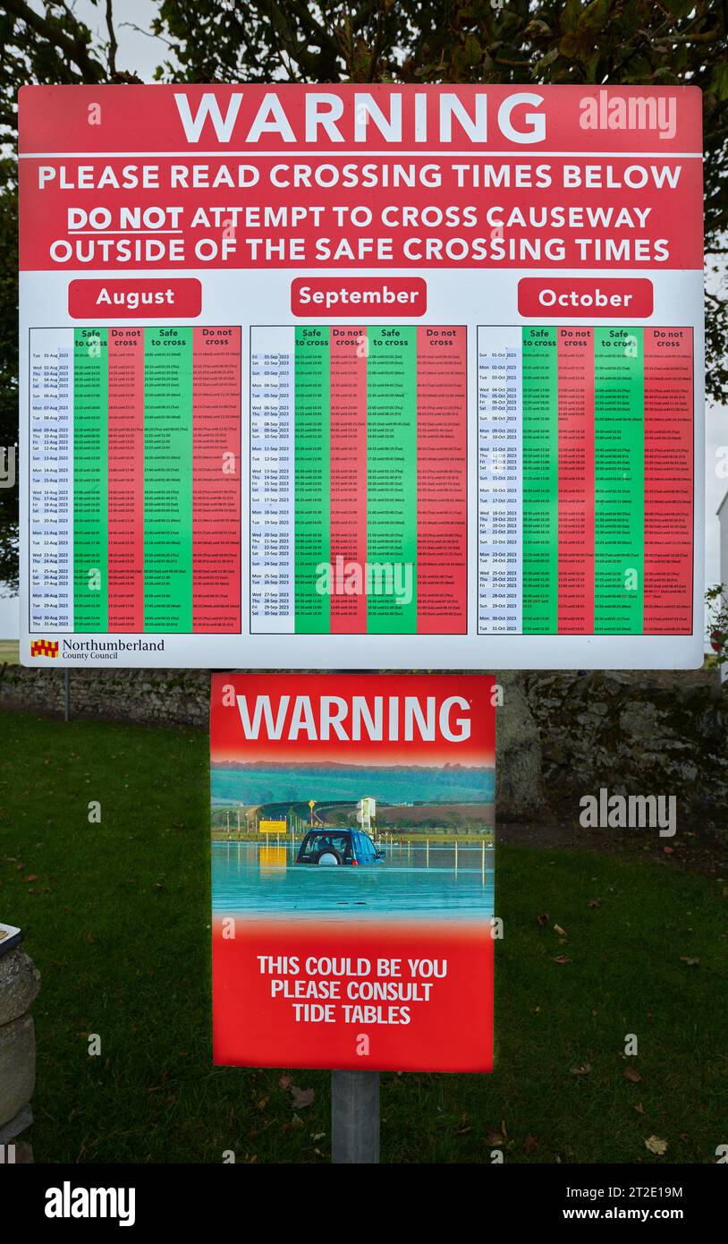 https://c8.alamy.com/comp/2T2E19M/notice-board-warning-about-crossing-the-causeway-when-the-tide-is-out-to-and-from-the-holy-island-of-lindisfarne-northumberland-england-2T2E19M.jpg