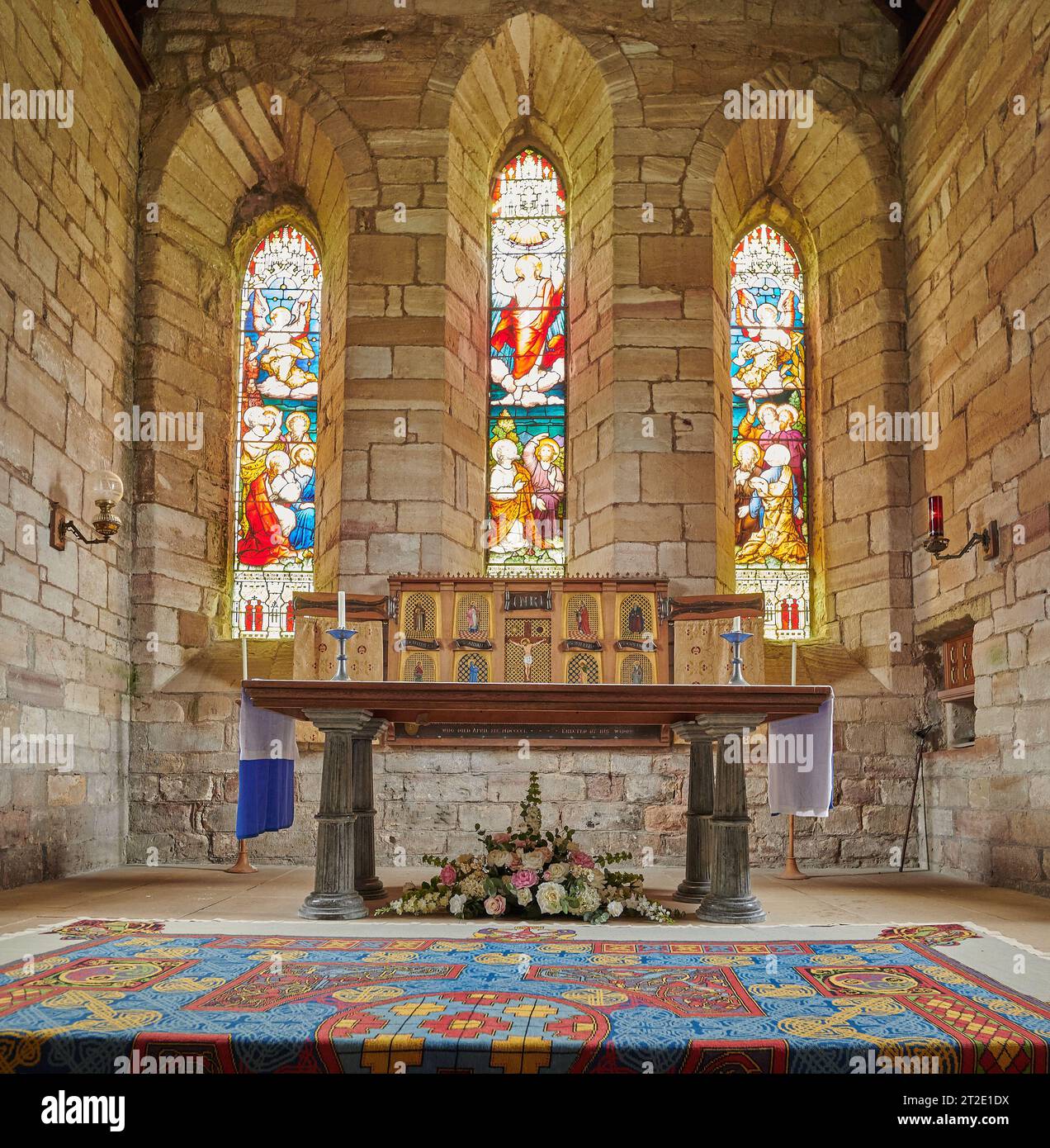 Sanctuary and altar in the church of St Mary (built, probably, on the site of the celtic monastery of St Aidan and St Cuthbert) on the Holy Island of Stock Photo