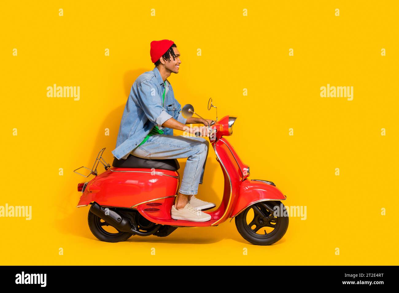 Full body photo of attractive young man driving ride retro red moped ...