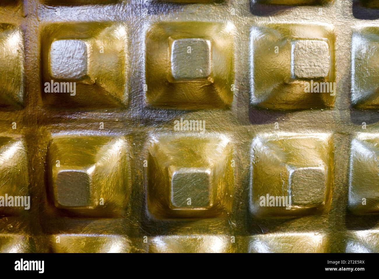 Golden bulging pyramids on the wall, background Stock Photo - Alamy