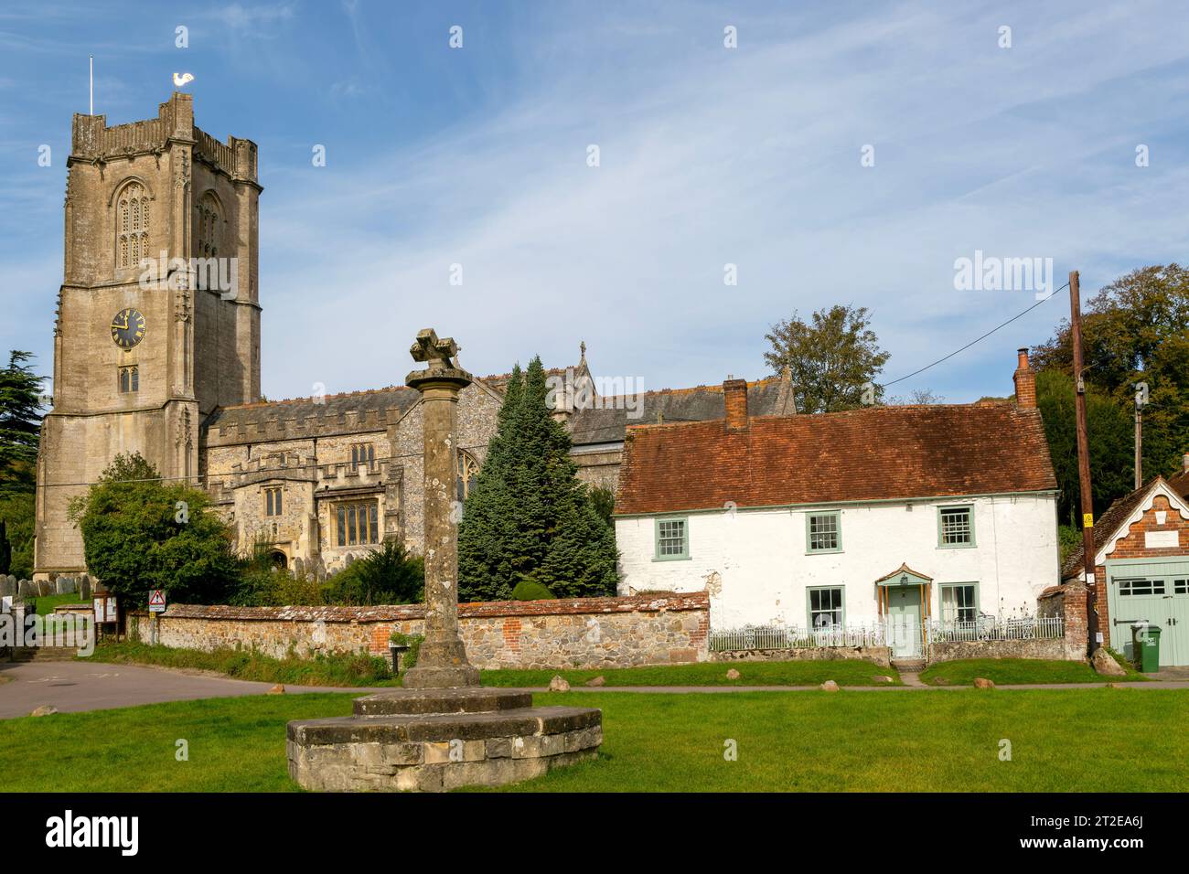 Historic buildings cottage and church of Saint Michael, Aldbourne, Wiltshire, England, UK Stock Photo