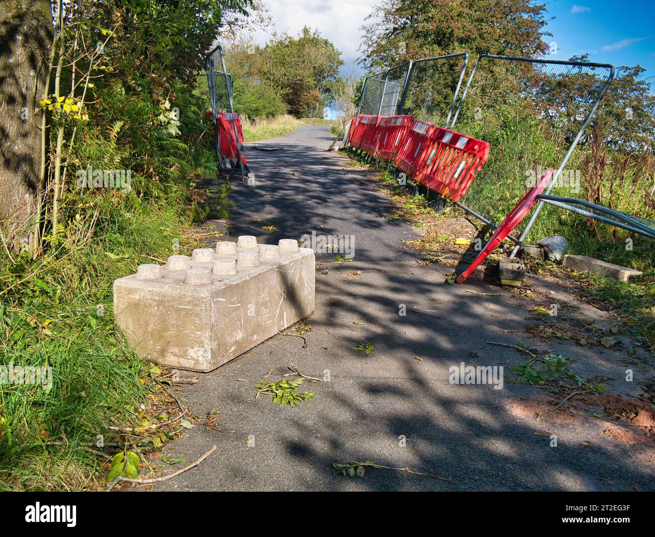 What looks like a giant, concrete Lego block at the side of a country lane in Derbyshire, UK. Taken on a sunny day in autumn. Stock Photo