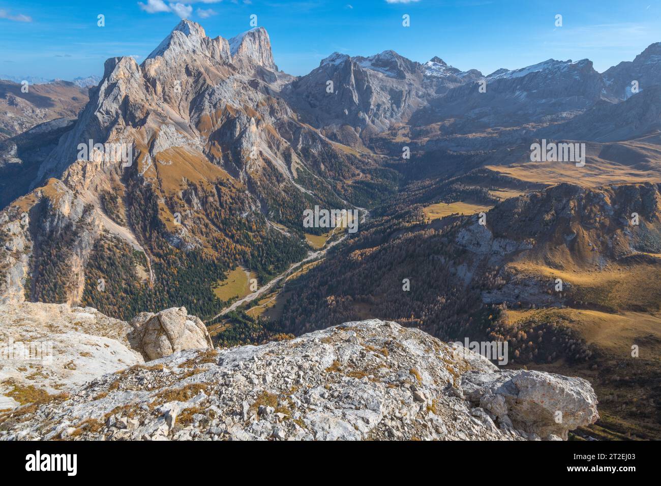 Marmolada, queen of the Dolomites, imposing mountain towering the Contrin valley below. Autumnal vegetation in high alpine country. Stock Photo