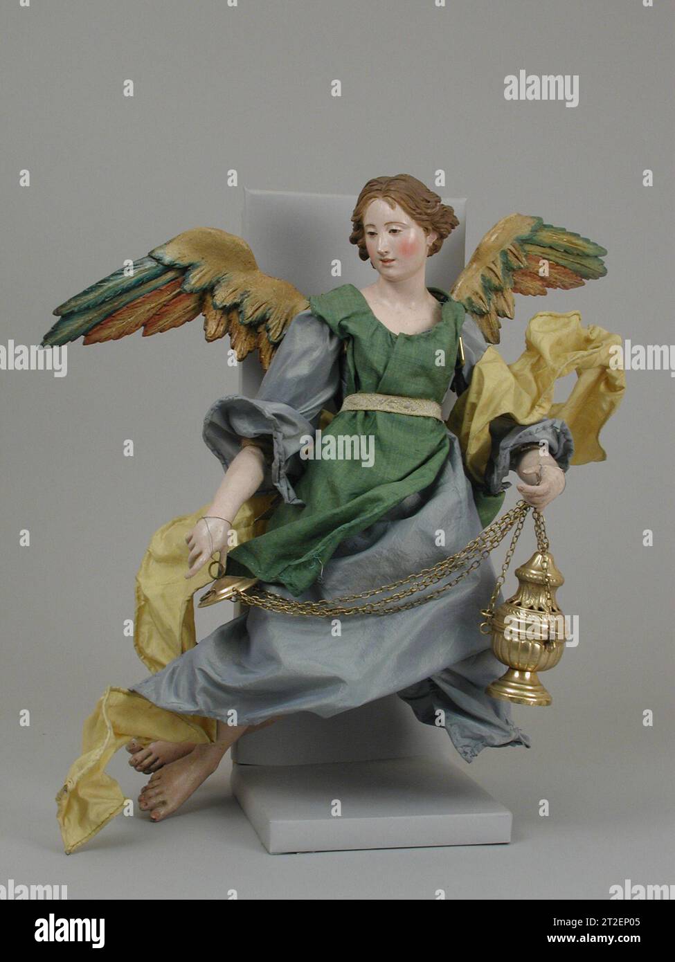 Angel Italian, Naples 18th–19th century View more. Angel. Italian, Naples. 18th–19th century. Polychromed terracotta head; wooden limbs and wings; straw and various fabrics; silver gilt censer. Crèche Stock Photo