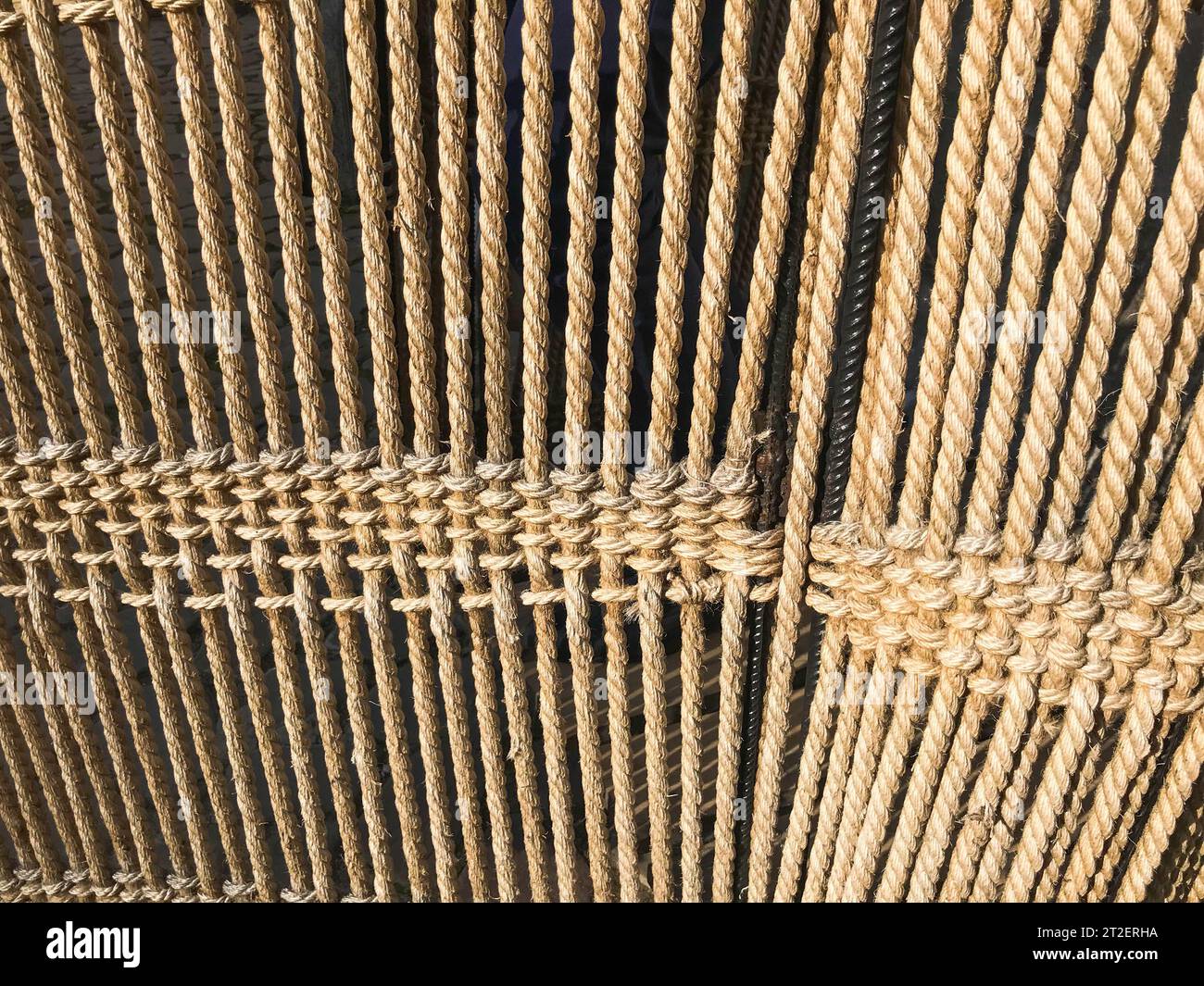 Natural Rope Material The texture of the set of brown interlaced natural ropes, ropes of ...
